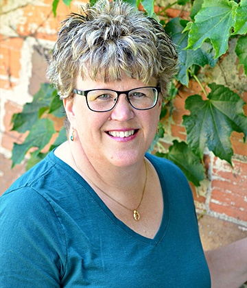 Headshot of office assistant, Sheryl Chizek.